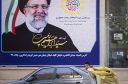 Iran’s favored candidate races to a hollow victory